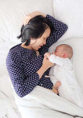 Survival of the Sleepiness, How To Cope With No Sleep - Mom Sleeping Next to Her Baby